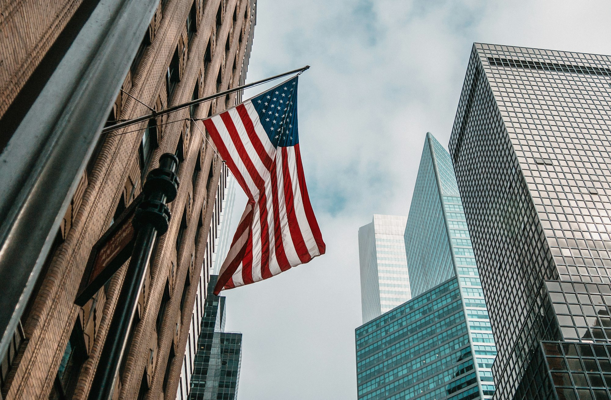 An American flag on a city building
